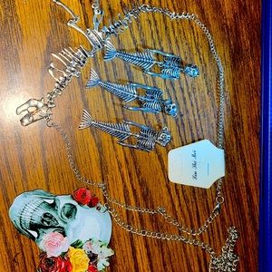 Lot of 3 skeleton mermaids, 1 skeleton t-Rex and 1 wooden skull necklace